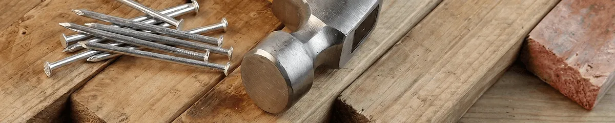 Hammer and nails on hardwood flooring boards in Atlanta, GA