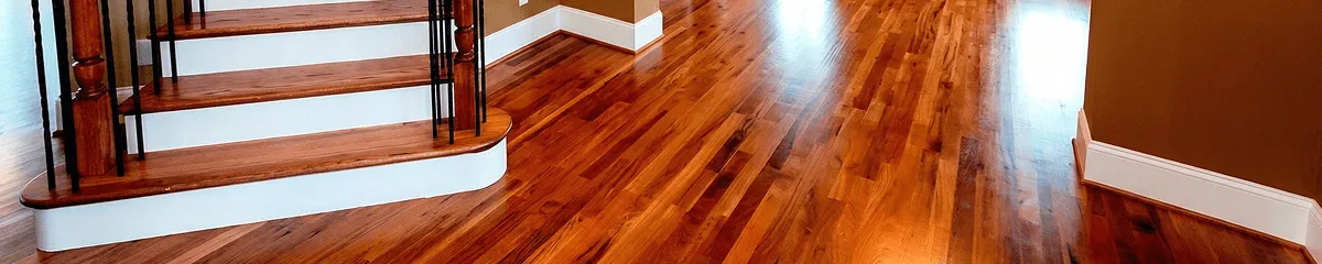 Base floor of a staircase with professionally restored wood flooring in Atlanta GA