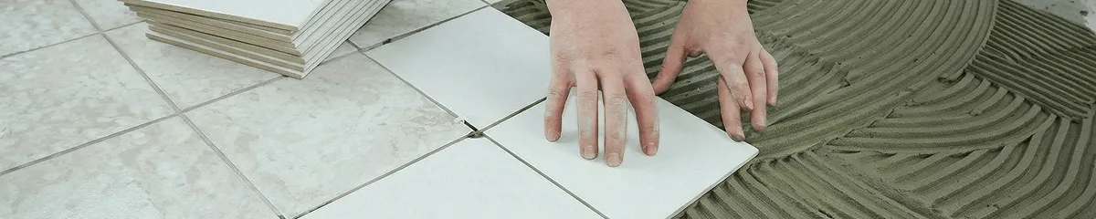 Professional installing white tile floors in Atlanta, GA