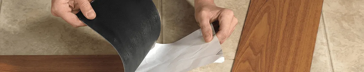 A professional installing vinyl flooring in Atlanta, GA
