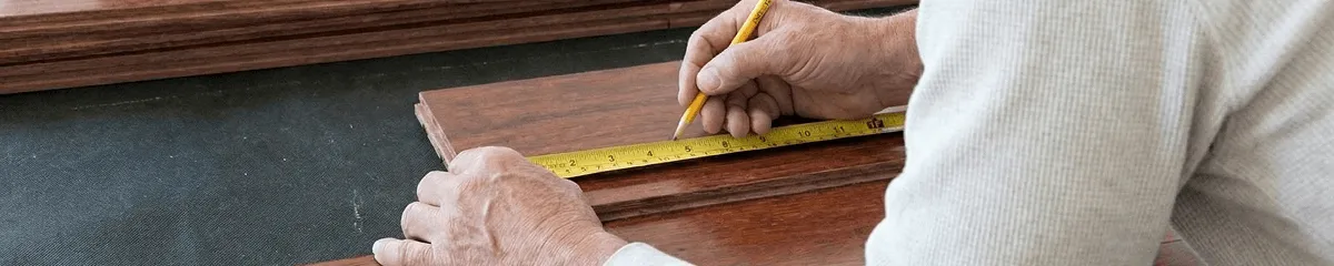 A professional installing wood flooring in Atlanta, GA